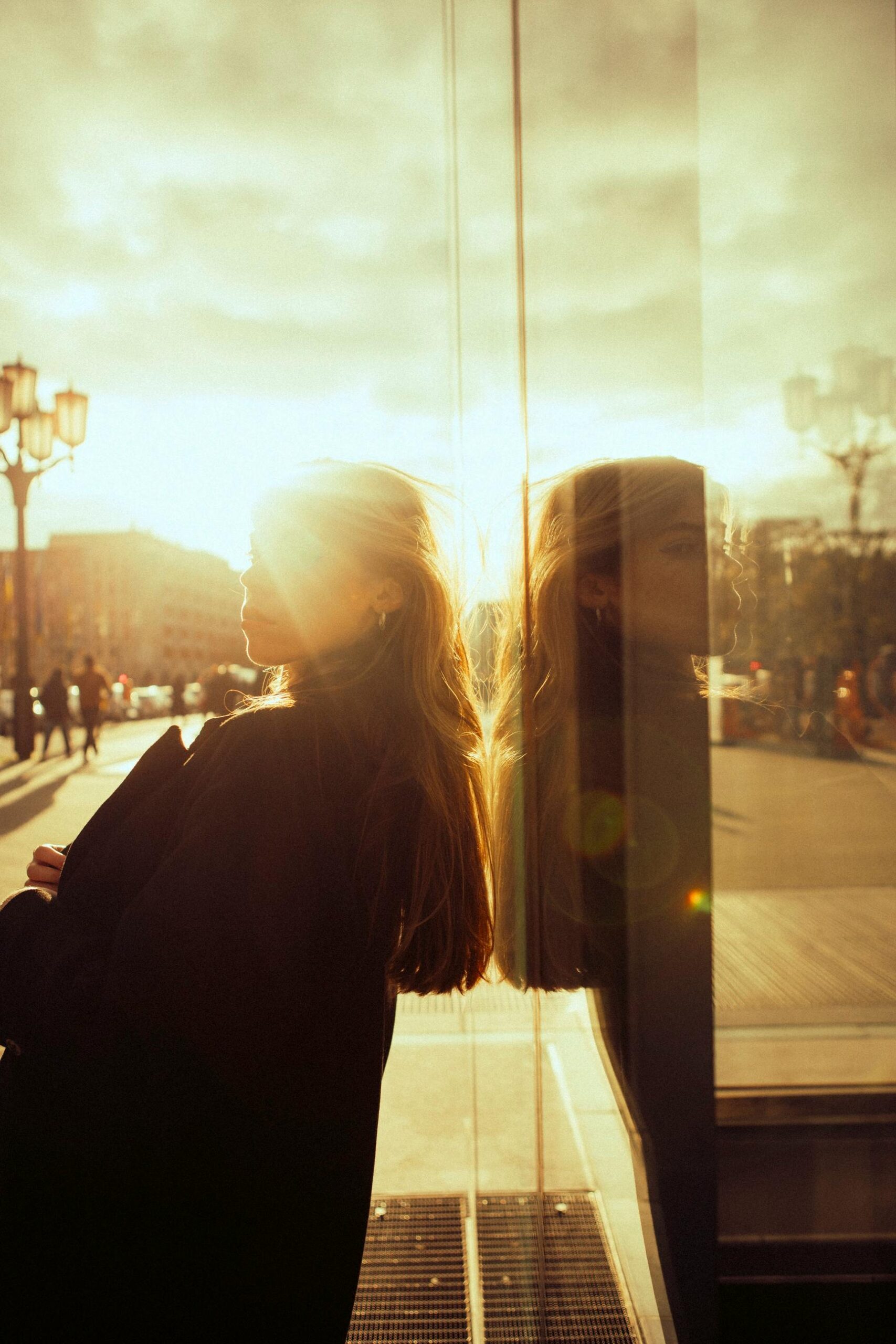 a lady standing in the warm sun